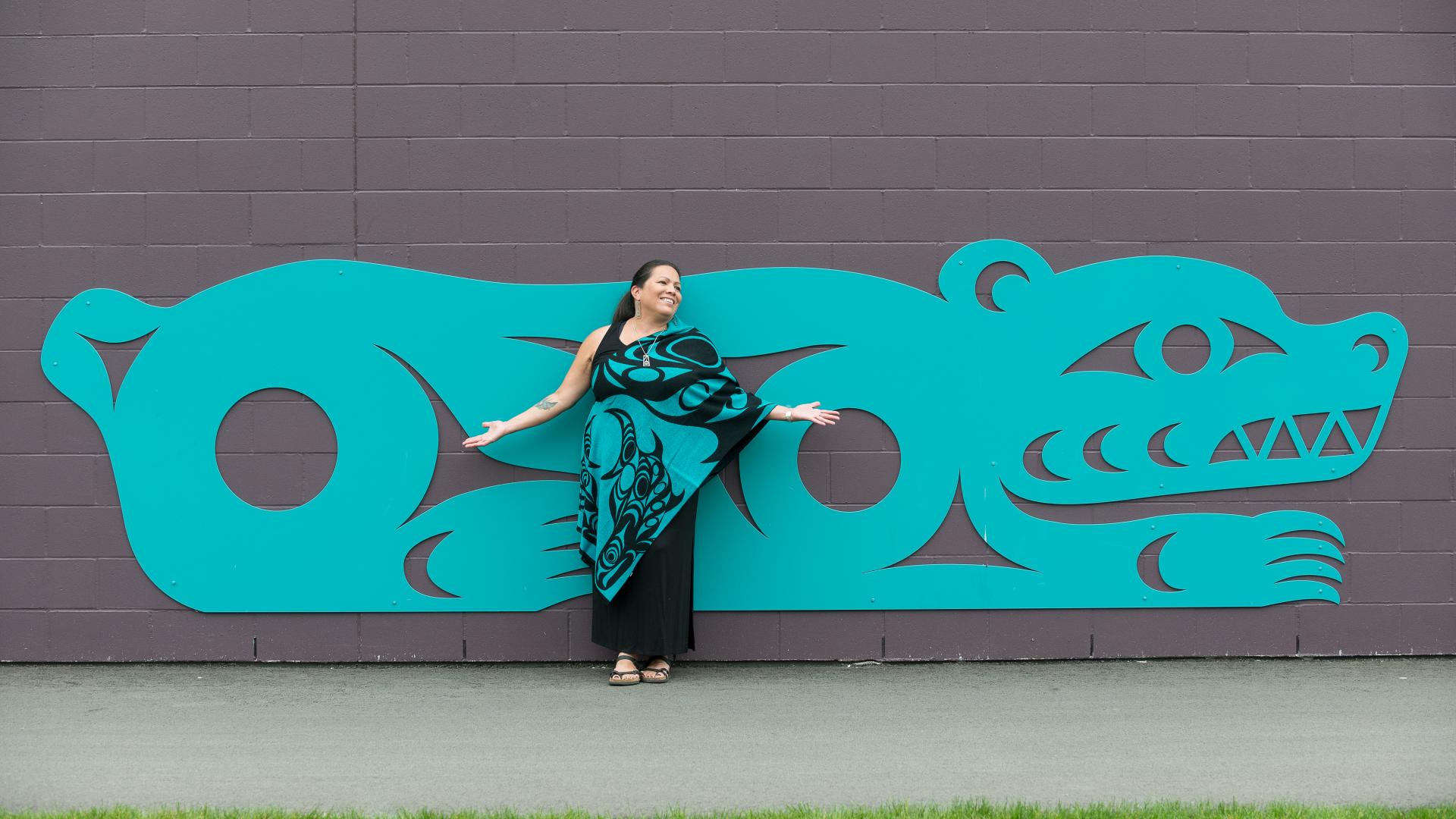 Artist Phyllis Atkins with her artwork installation at Telosky Stadium